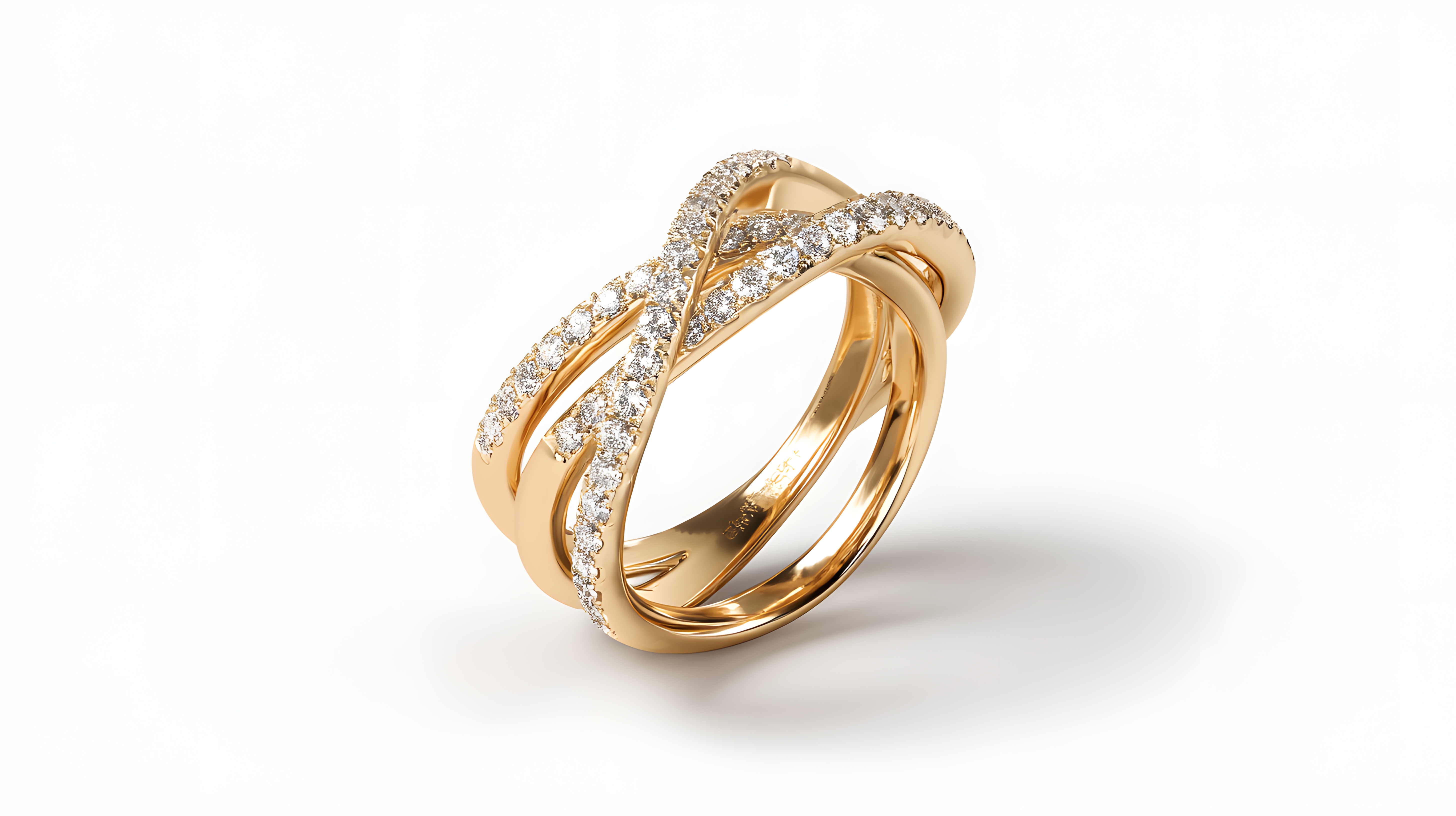 Gold criss-cross diamond ring on a reflective white background
