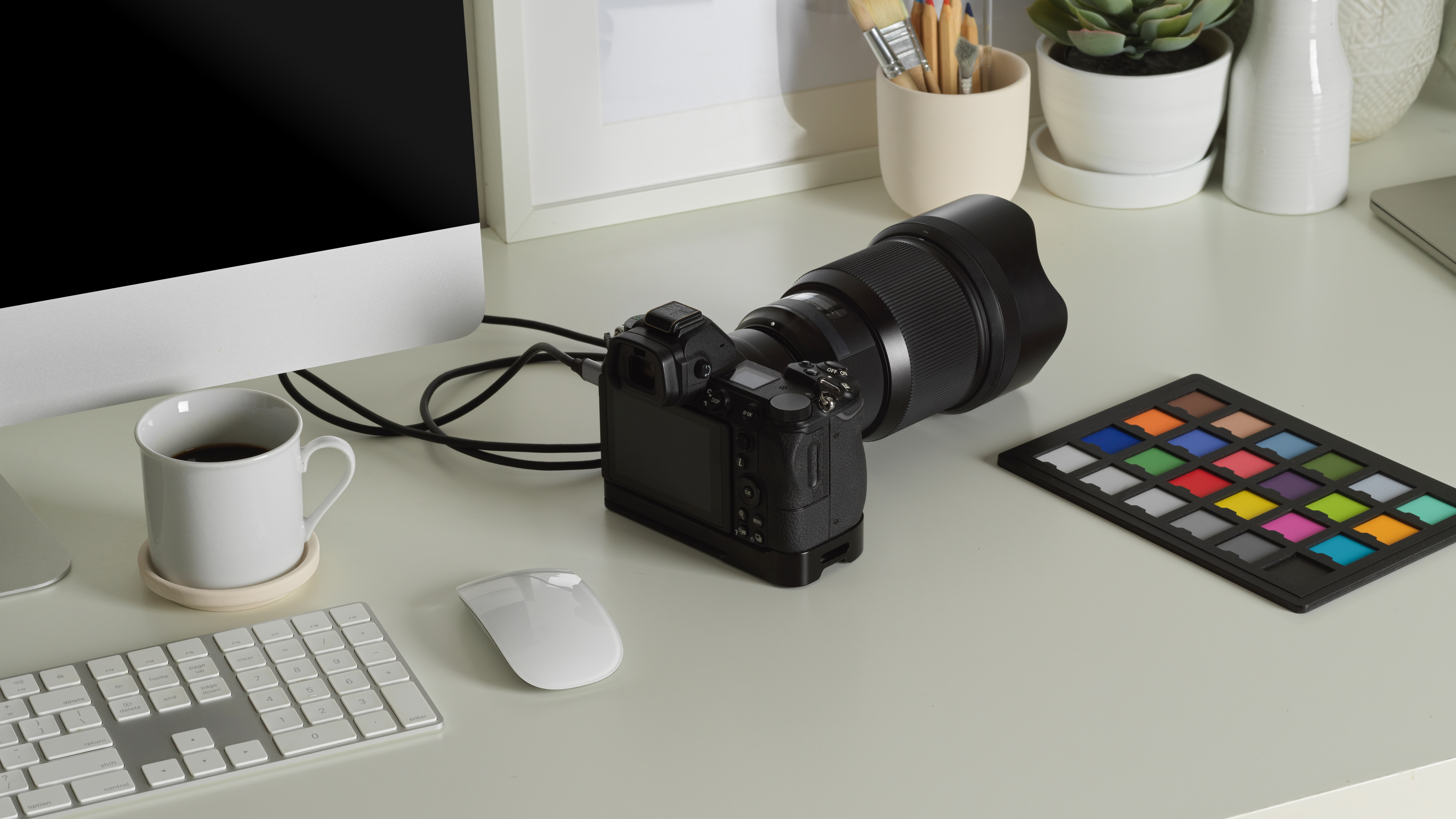 Worktable with camera and colour checker for accurate product color matching in ecommerce photo editing